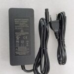 Battery charger with power cables.